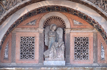 Bas-relief arch over the gate to the Saint Marks Basilica (Patriarchal Cathedral Basilica of Saint Mark), St. Mark's Square, Venice, Italy, UNESCO World Heritage Sites