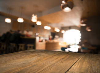 blurred background of bar and dark brown desk space of retro wood
