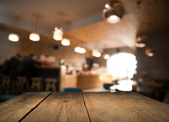 blurred background of bar and dark brown desk space of retro wood
