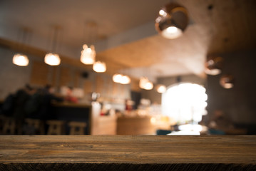blurred background of bar and dark brown desk space of retro wood