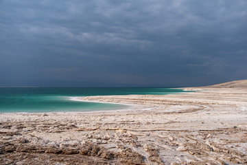 Beautiful green white salty coastline of Dead sea in Jordan