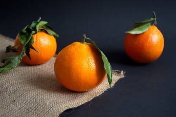 Closeup shot of oranges on the black background