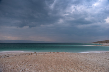Beautiful green white salty coastline of Dead sea in Jordan