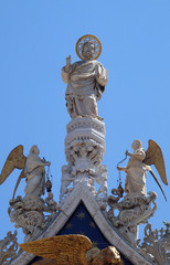 Fototapeta na wymiar Saint Mark, marble statue, detail of the facade of the Saint Mark's Basilica, St. Mark's Square, Venice, Italy, UNESCO World Heritage Sites 