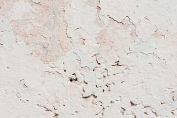 Wall fragment with scratches and cracks
