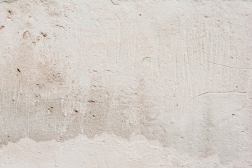 Wall fragment with scratches and cracks