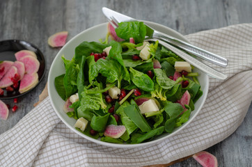 Spinach salad on white plate