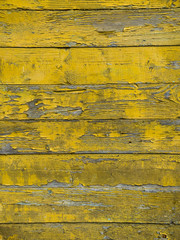Old wooden background of boards with cracked and peeling paint