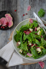 Spinach salad on white plate