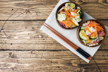 Vegetarian salad of raw fresh vegetables in a plate. Concept healthy eating.