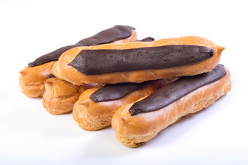 Chocolate eclairs on a white background. Sweet dessert.