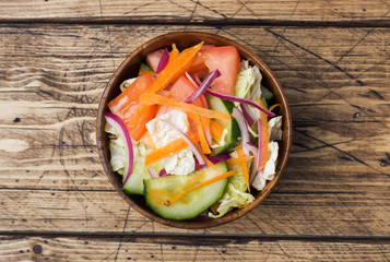Vegetarian salad of raw fresh vegetables in a plate. Concept healthy eating.