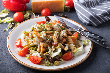 Seafood salad with vegetables on a plate.