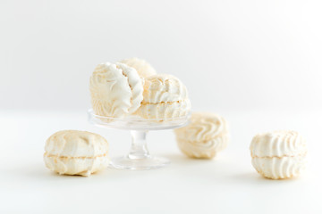 food, confection and sweets concept - close up of zephyr dessert over white background