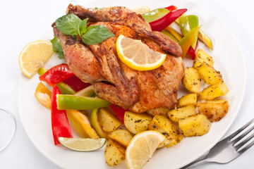 whole grilled holiday chicken on a plate