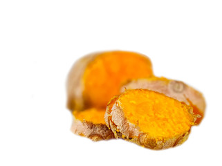 turmeric root close-up isolated on white, concept healthy Ayurveda food