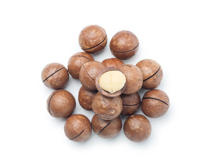 Pile of macadamia nuts isolated on white background. Top view.