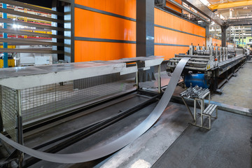 Roller forming machine. The interior of the plant producing a metal profile.