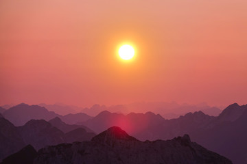 LENS FLARE: Bright morning sun shines on the stunning mountain range in Slovenia