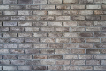 Patterned gray brick wall for background picture.