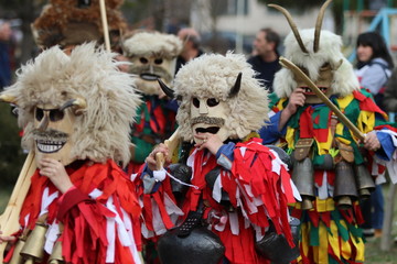 Zemen, Bulgaria - March 16, 2019: Masquerade festival Surva in Zemen, Bulgaria. People with mask called Kukeri dance and perform to scare the evil spirits.