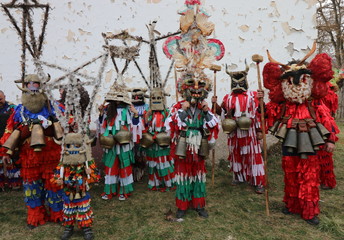 Fototapeta na wymiar Zemen, Bulgaria - March 16, 2019: Masquerade festival Surva in Zemen, Bulgaria. People with mask called Kukeri dance and perform to scare the evil spirits.