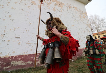 Obraz premium Zemen, Bulgaria - March 16, 2019: Masquerade festival Surva in Zemen, Bulgaria. People with mask called Kukeri dance and perform to scare the evil spirits.