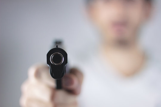 Robber With Gun Threatening Someone To