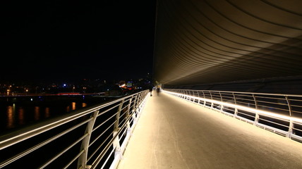 Walking path on subway bridge. Night scene. White lights. It was shoot in Istanbul.