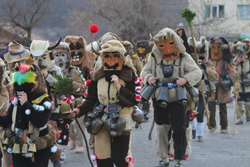 Obraz premium Zemen, Bulgaria - March 16, 2019: Masquerade festival Surva in Zemen, Bulgaria. People with mask called Kukeri dance and perform to scare the evil spirits.