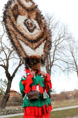 Zemen, Bulgaria - March 16, 2019: Masquerade festival Surva in Zemen, Bulgaria. People with mask called Kukeri dance and perform to scare the evil spirits.