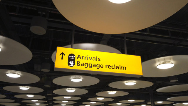 Arrivals and baggage reclaim sign at an international airport