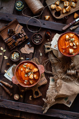Two clay bowls with vegetable cream soup