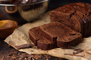 Homemade chocolate cake and cream with whisk
