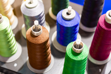 Multicolored spools of thread.