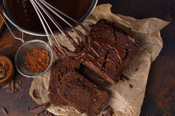 Homemade chocolate cake and cream with whisk