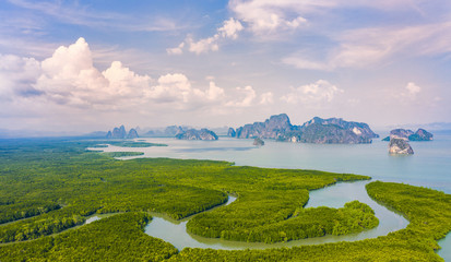 View from above, aerial view of the beautiful Phang Nga Bay (Ao Phang Nga National Park) with the sheer limestone karsts that jut vertically out of the emerald-green water, Thailand.