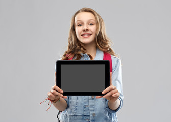 education, school and people concept - happy smiling teenage student girl with bag showing blank tablet computer screen over grey background