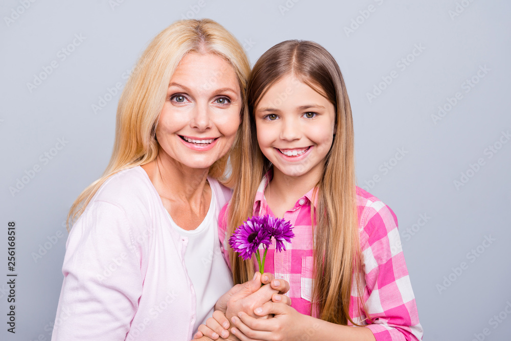 Sticker Close up photo two blond haired she her granny grandma little granddaughter weekend 8 march holiday unexpected flowers wear pink plaid checkered shirt sweater pullover isolated light grey background