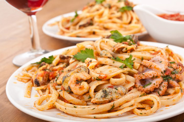 two plates of  seafood vongole pasta
