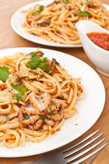 two plates of  seafood vongole pasta