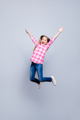 Fototapeta na wymiar Full length body size vertical photo blond haired she her little cheerleader laugh laughter jump high achievement wear casual jeans pink plaid checkered shirt outfit clothes isolated grey background