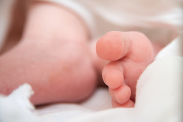 baby feet closeup on white background, newborn baby