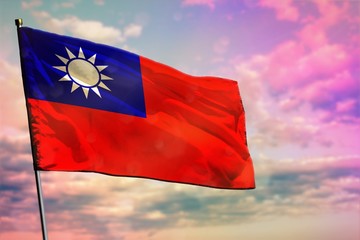 Fluttering Taiwan Province of China flag on colorful cloudy sky background. Prosperity concept.