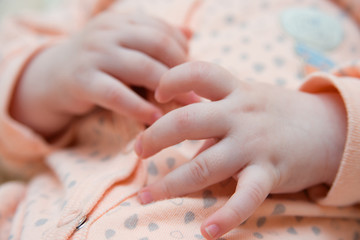 hand newborn close-up in different positions, during sleep