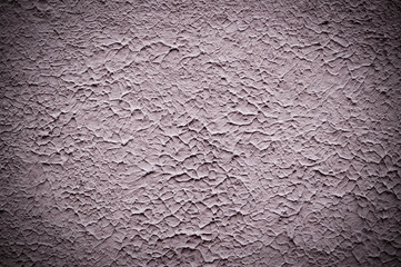 beige painted relief wall with vignette. background, texture.
