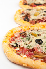 three different kind of pizzas isolated on white