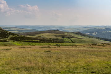 Fototapeta na wymiar Peak District landscape, walking towards Stanage Edge near Hathersage in the East Midlands, Derbyshire, England, UK