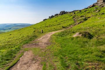 Peak District landscape, walking towards Stanage Edge near Hathersage in the East Midlands, Derbyshire, England, UK