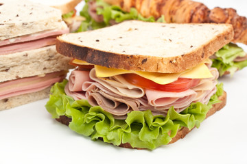 group of tasty sandwiches on a wooden table